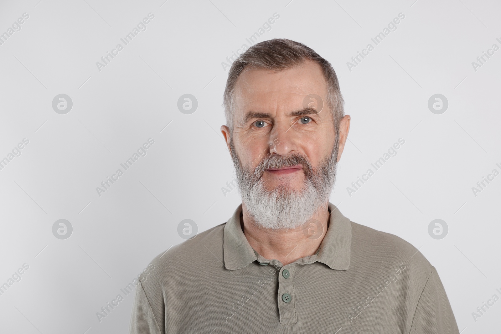 Photo of Portrait of senior man on white background