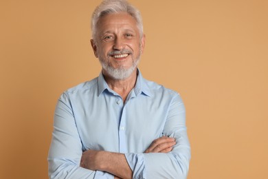 Photo of Portrait of senior man on beige background