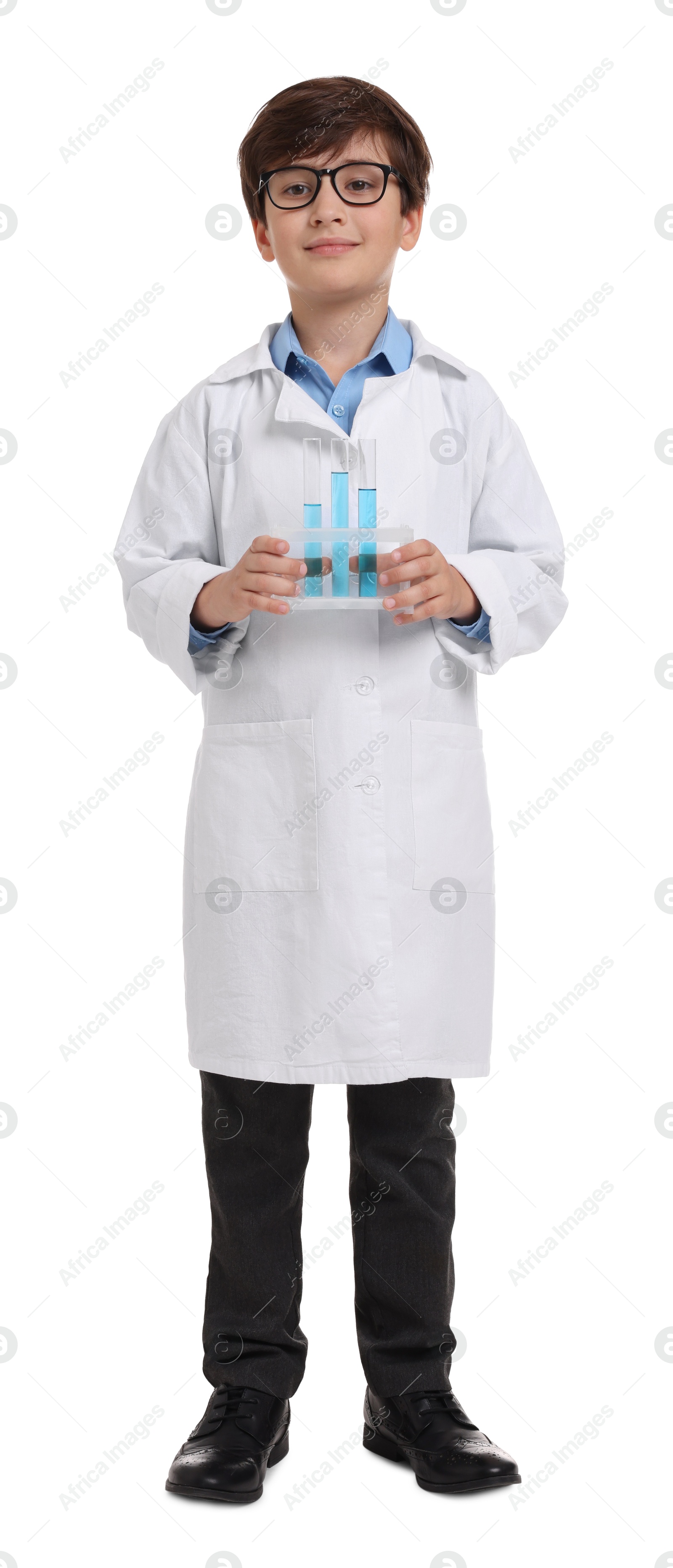 Photo of Boy with test tubes pretending to be scientist on white background. Dreaming of future profession