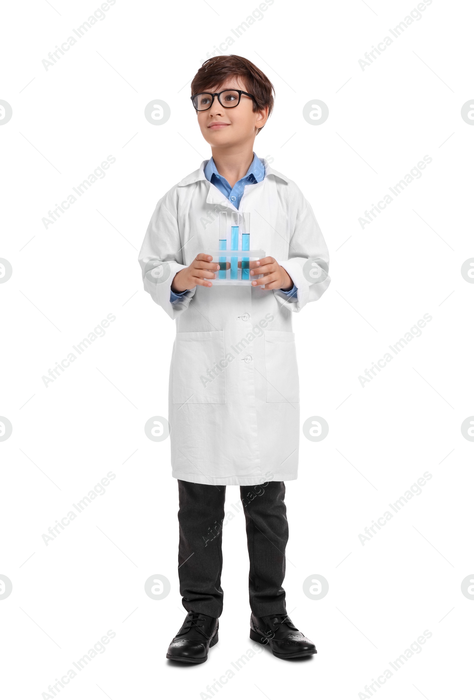 Photo of Boy with test tubes pretending to be scientist on white background. Dreaming of future profession