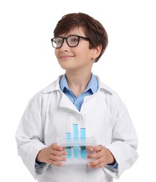 Photo of Boy with test tubes pretending to be scientist on white background. Dreaming of future profession