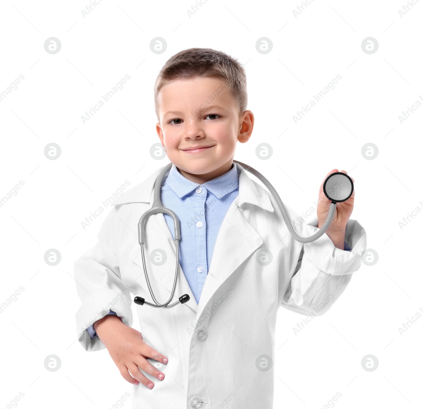 Photo of Little boy with stethoscope pretending to be doctor on white background. Dreaming of future profession