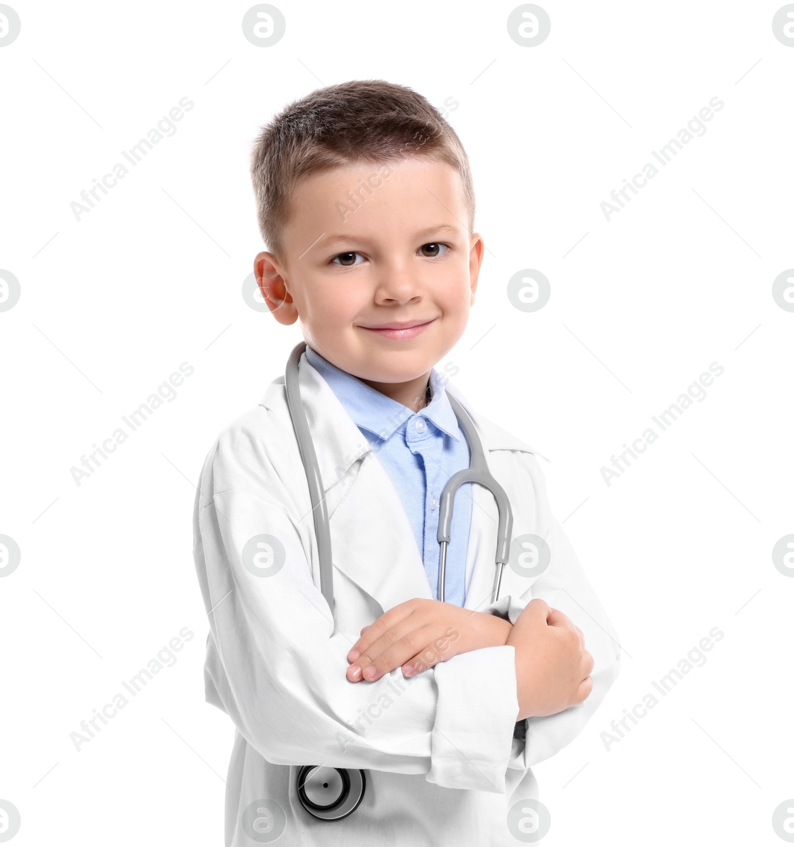 Photo of Little boy with stethoscope pretending to be doctor on white background. Dreaming of future profession