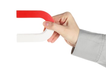 Photo of Woman with horseshoe magnet on white background, closeup