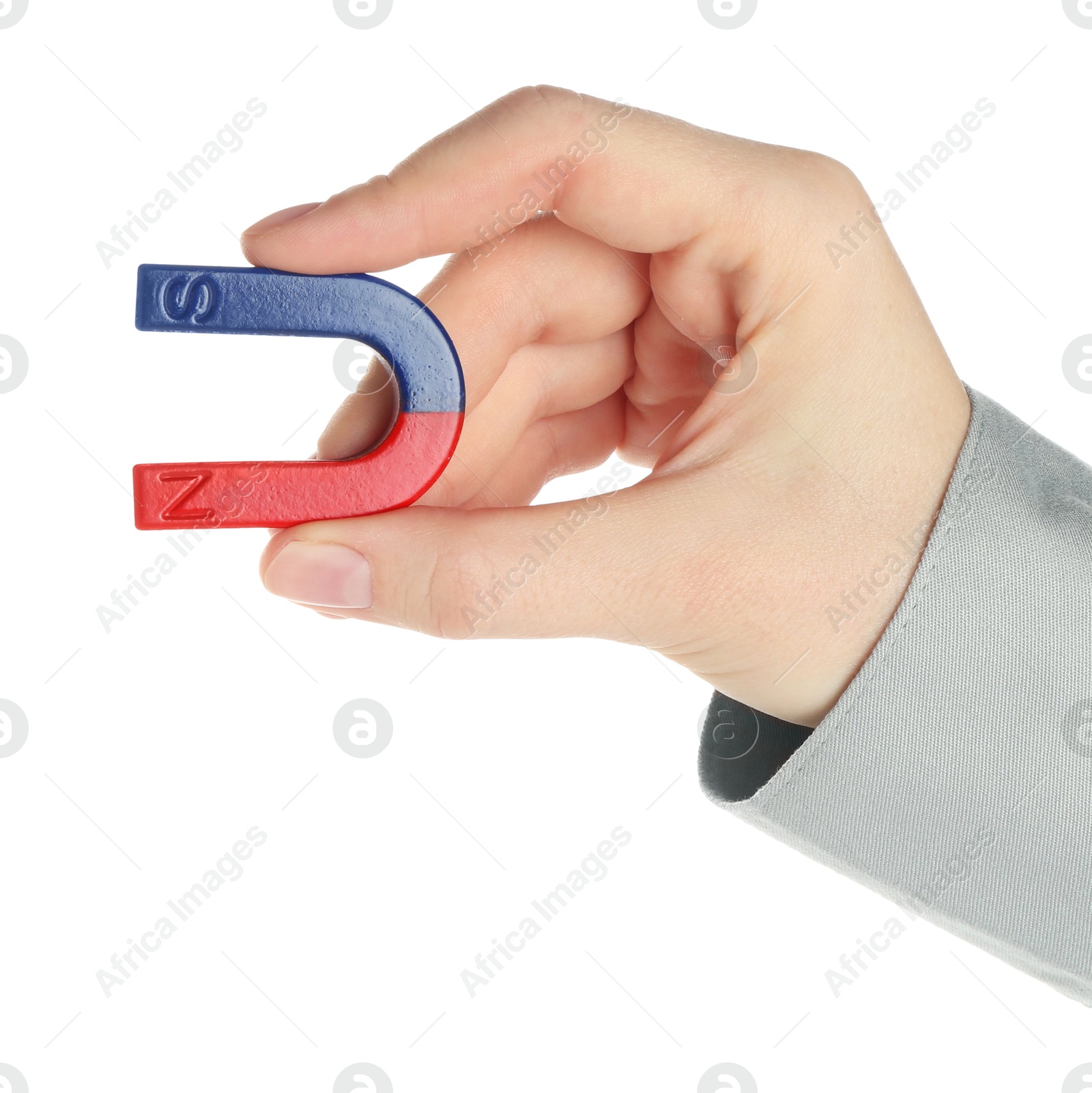 Photo of Woman with horseshoe magnet on white background, closeup