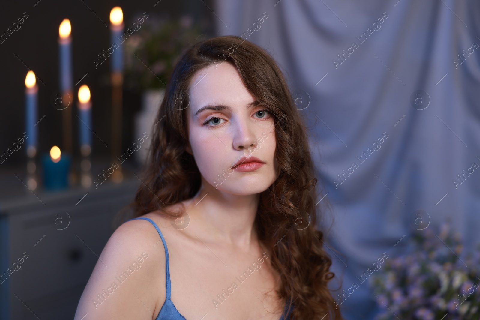 Photo of Beautiful young woman in room, closeup. Fashion vintage style portrait