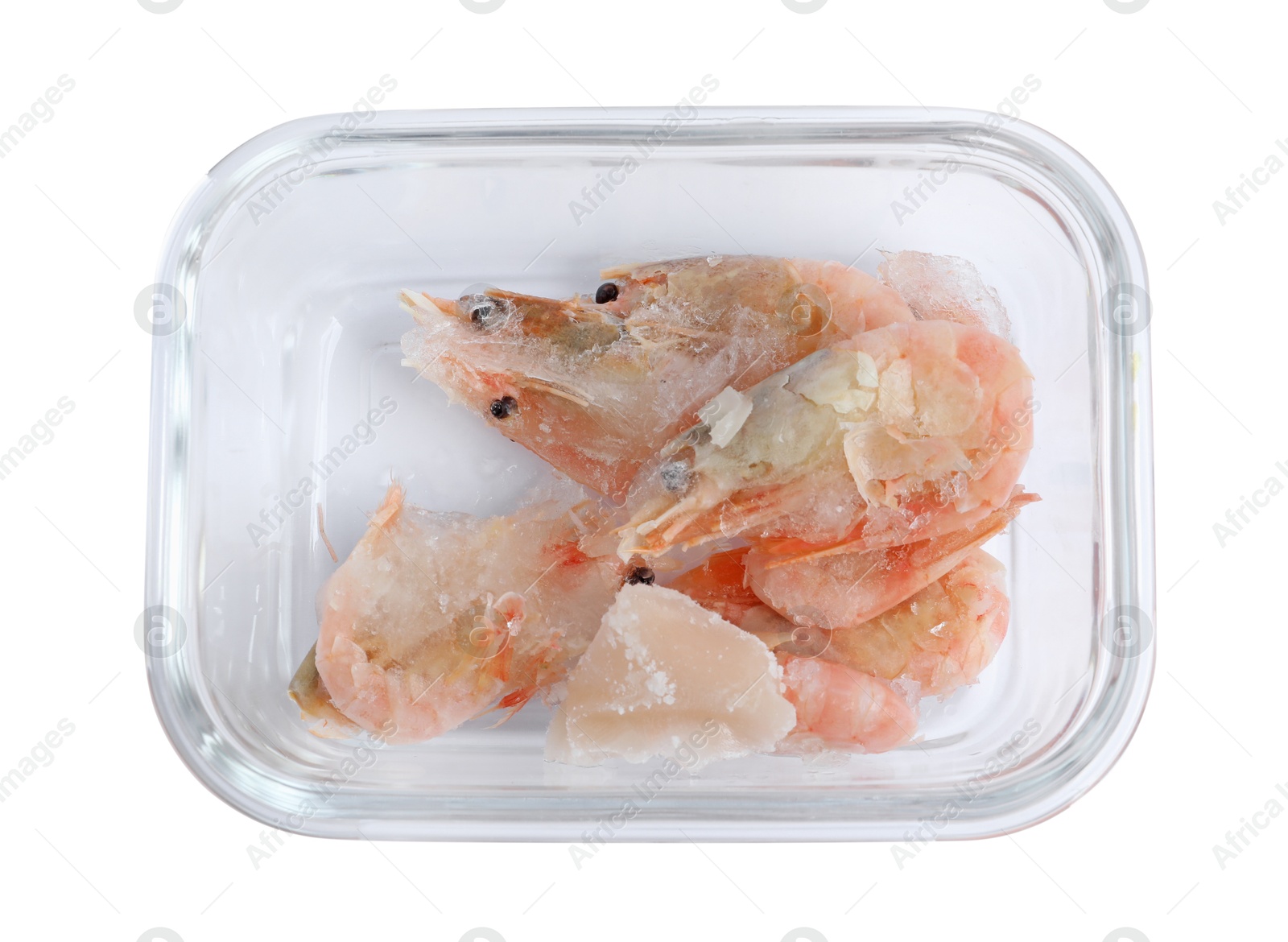 Photo of Frozen shrimps in container isolated on white, top view