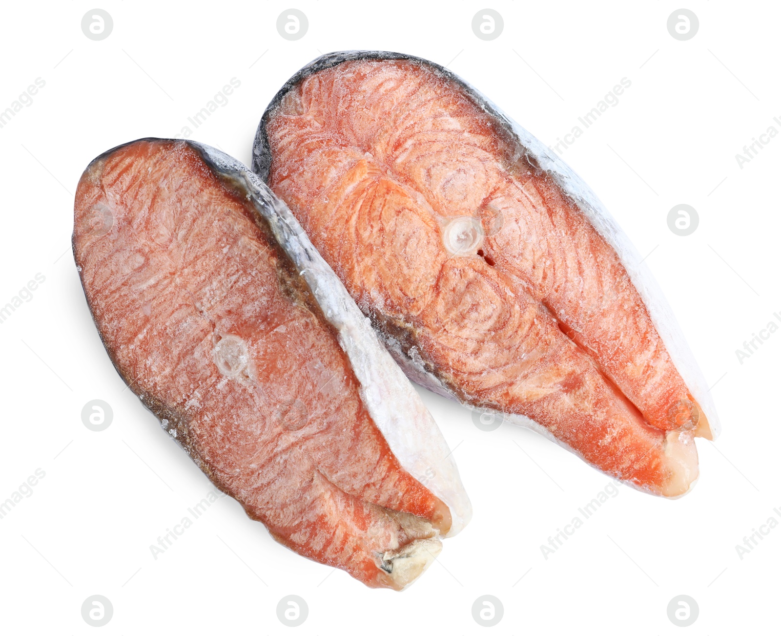 Photo of Two frozen salmon steaks isolated on white, top view