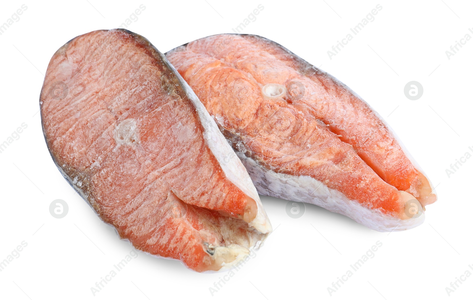 Photo of Two frozen salmon steaks isolated on white