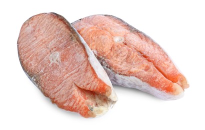 Photo of Two frozen salmon steaks isolated on white