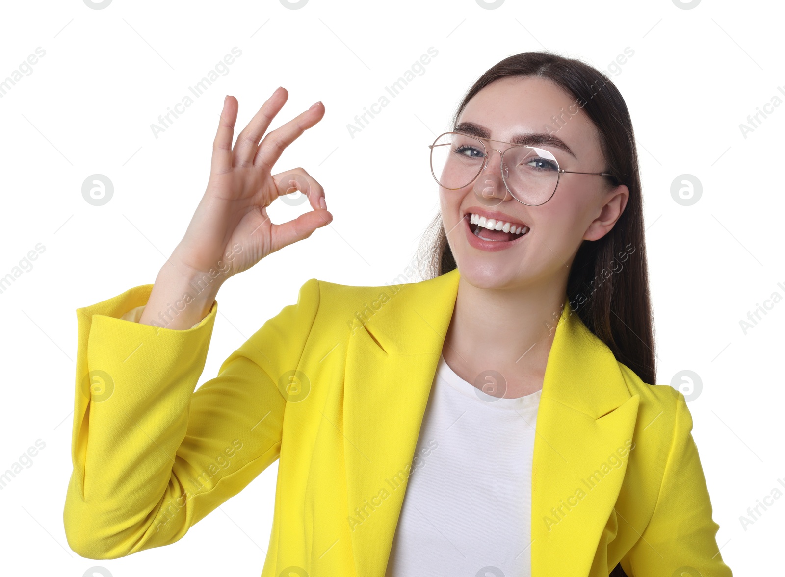 Photo of Happy young woman showing OK gesture on white background