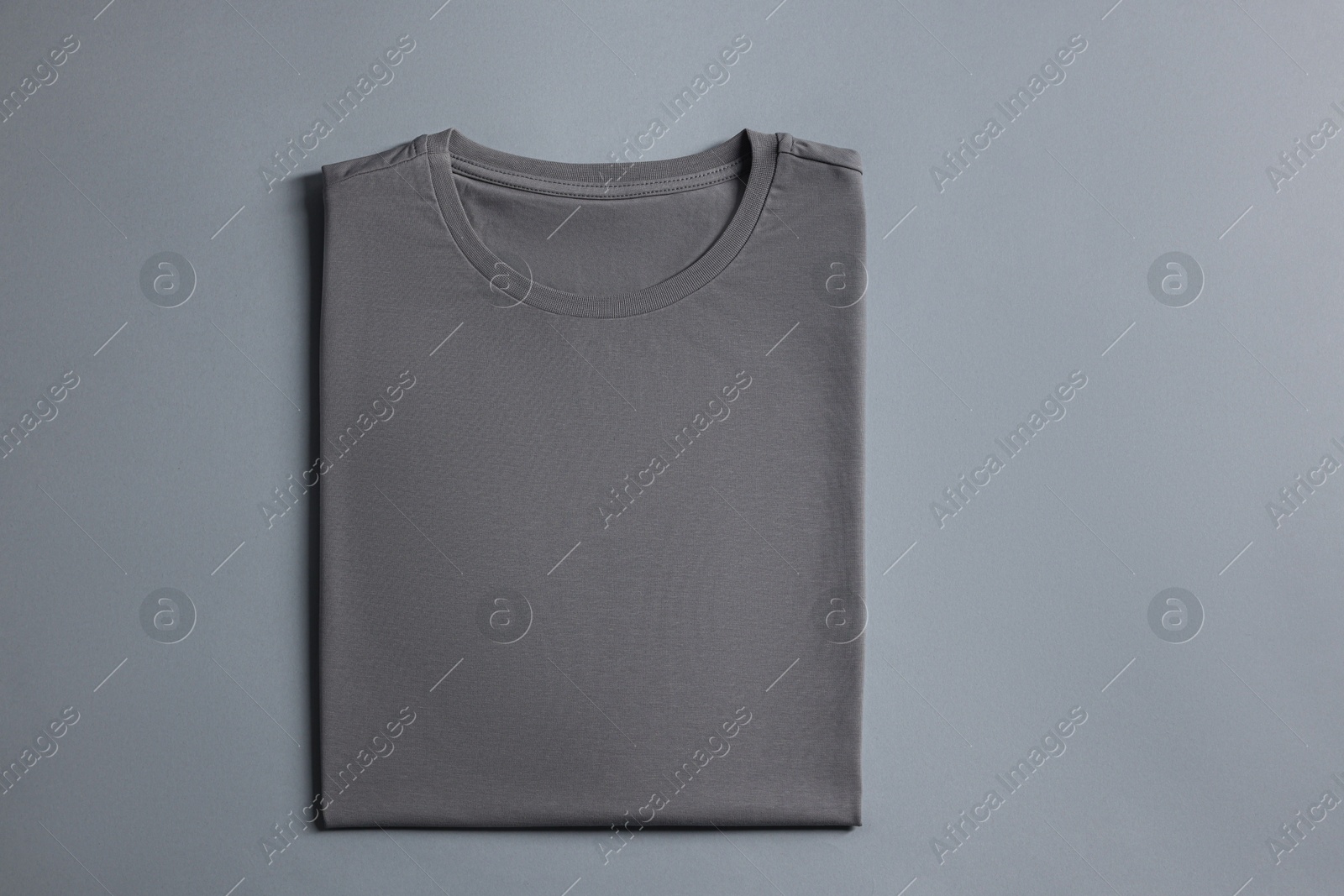 Photo of Blank t-shirt on grey background, top view. Mockup for design