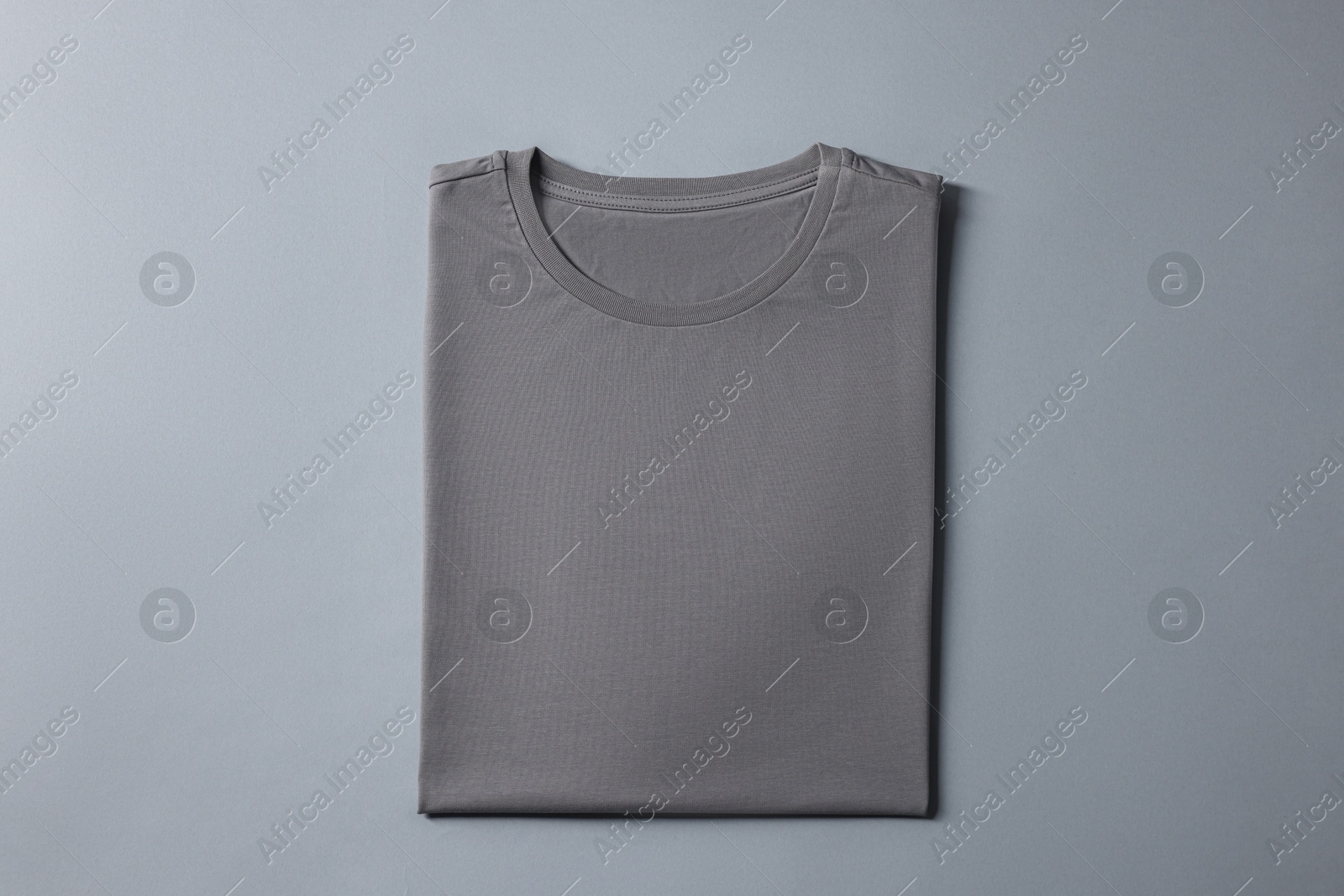 Photo of Blank t-shirt on grey background, top view. Mockup for design