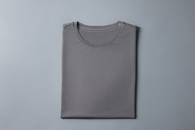 Photo of Blank t-shirt on grey background, top view. Mockup for design