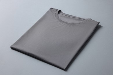 Photo of Blank t-shirt on grey background. Mockup for design