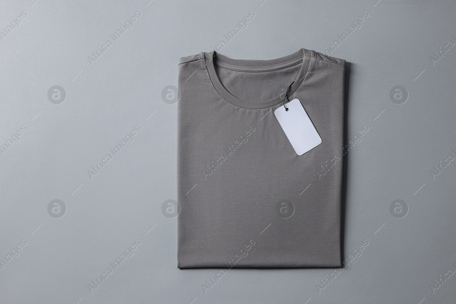 Photo of Blank t-shirt on grey background, top view. Mockup for design