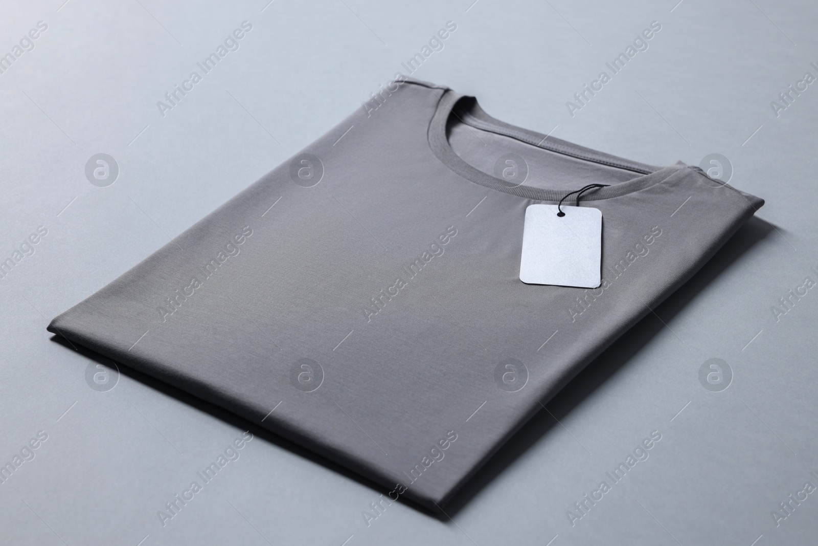 Photo of Blank t-shirt on grey background. Mockup for design