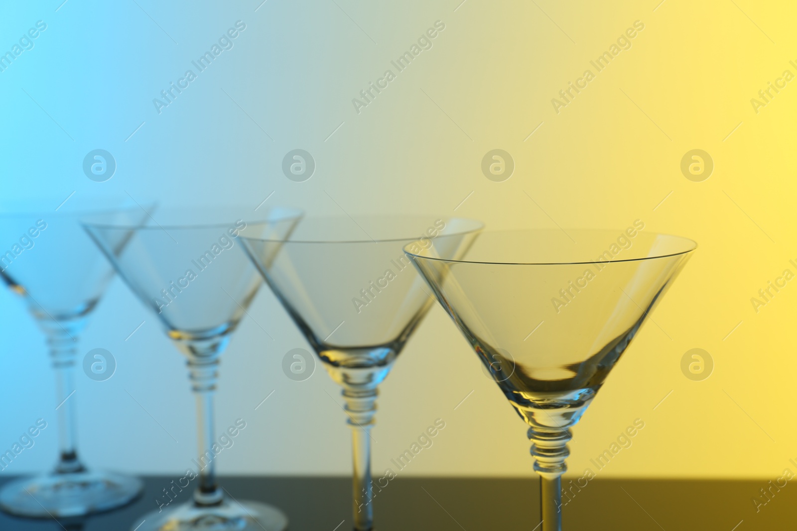 Photo of Empty glasses on table, color tone effect