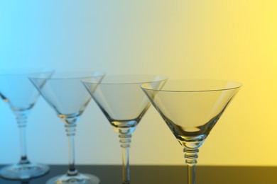 Photo of Empty glasses on table, color tone effect