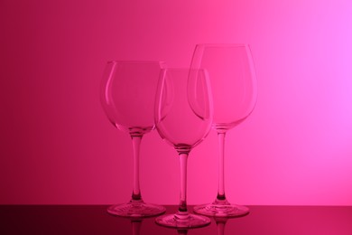 Photo of Empty glasses on table, color tone effect