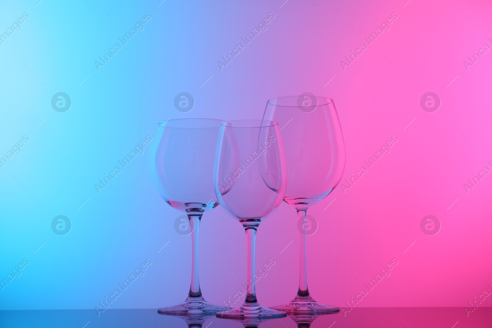 Photo of Empty glasses on table, color tone effect