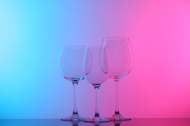 Photo of Empty glasses on table, color tone effect