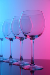 Photo of Empty glasses on table, color tone effect