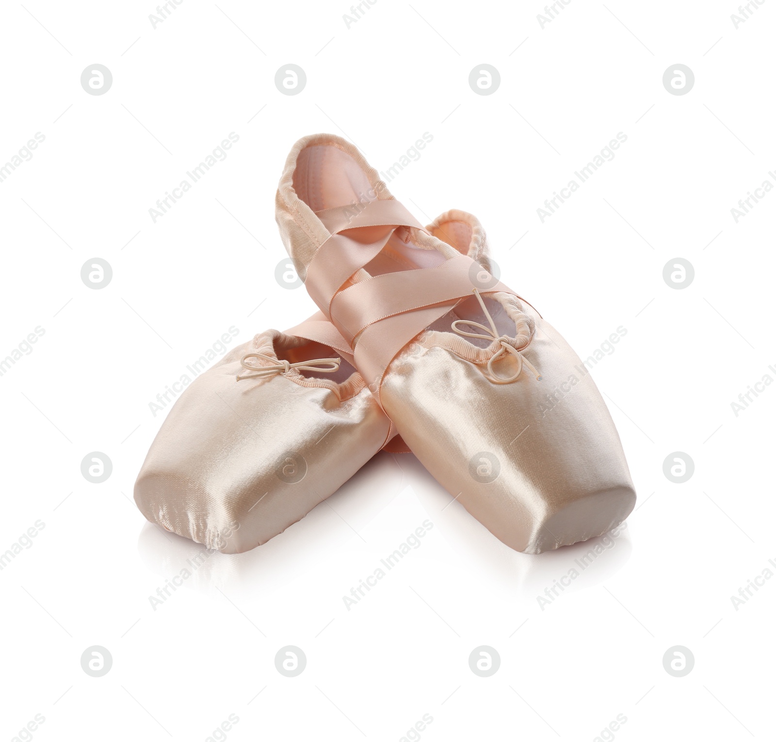 Photo of Pair of beautiful beige pointe shoes isolated on white