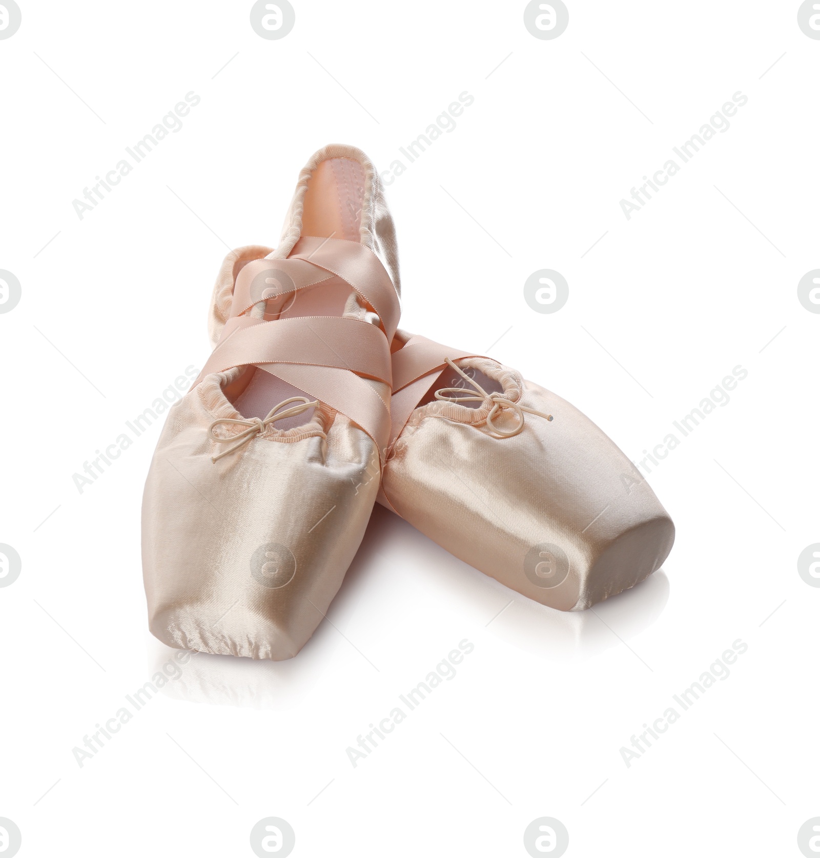 Photo of Pair of beautiful beige pointe shoes isolated on white