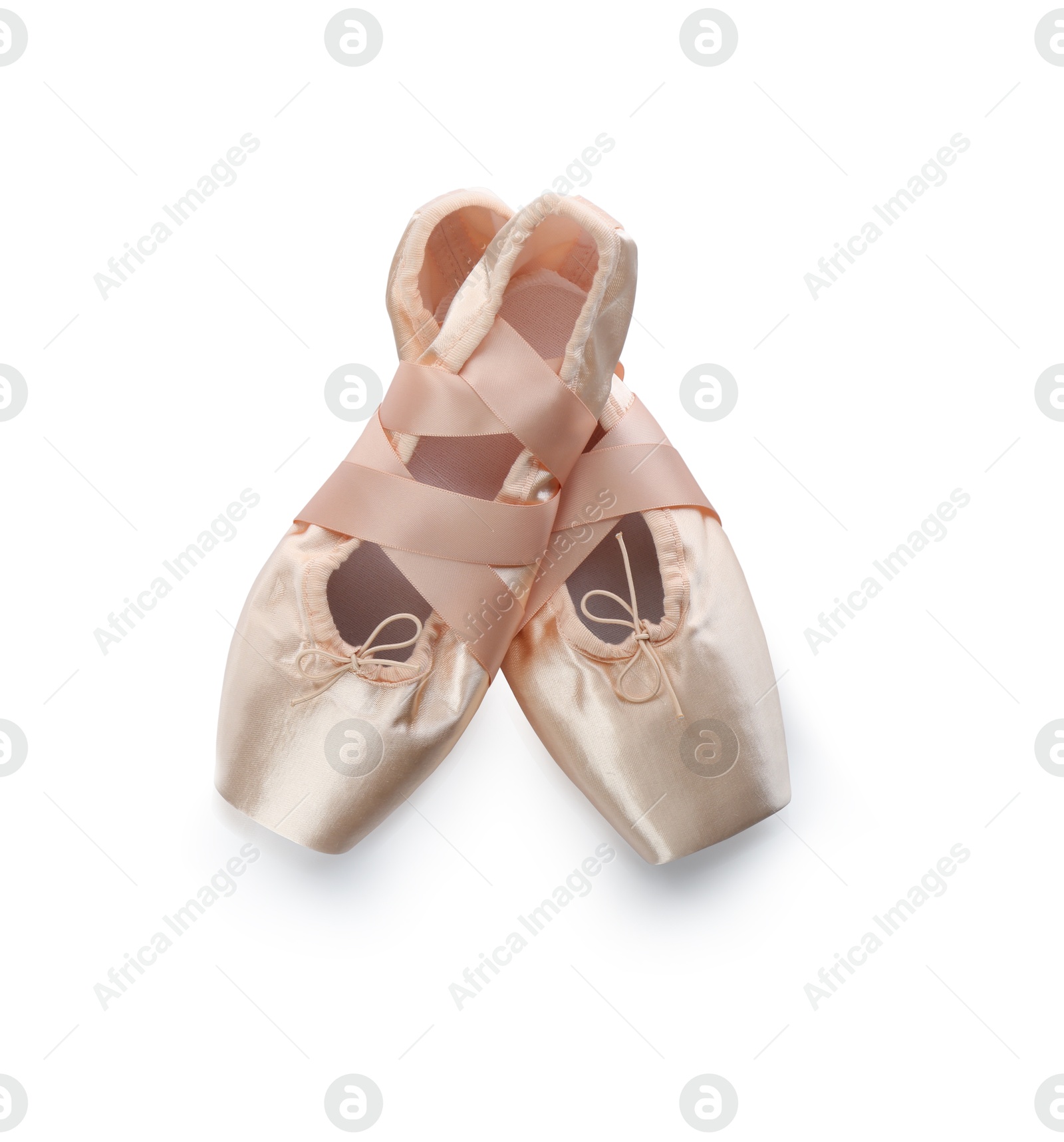 Photo of Pair of beautiful beige pointe shoes isolated on white