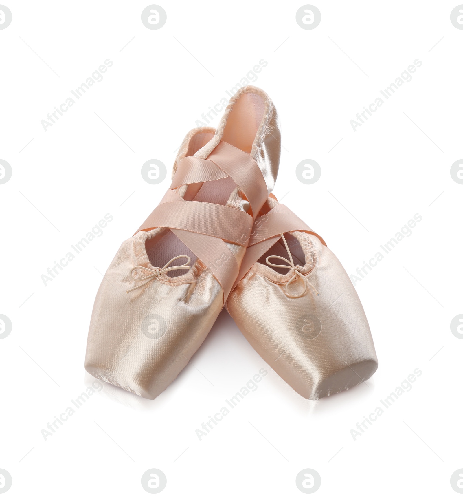 Photo of Pair of beautiful beige pointe shoes isolated on white