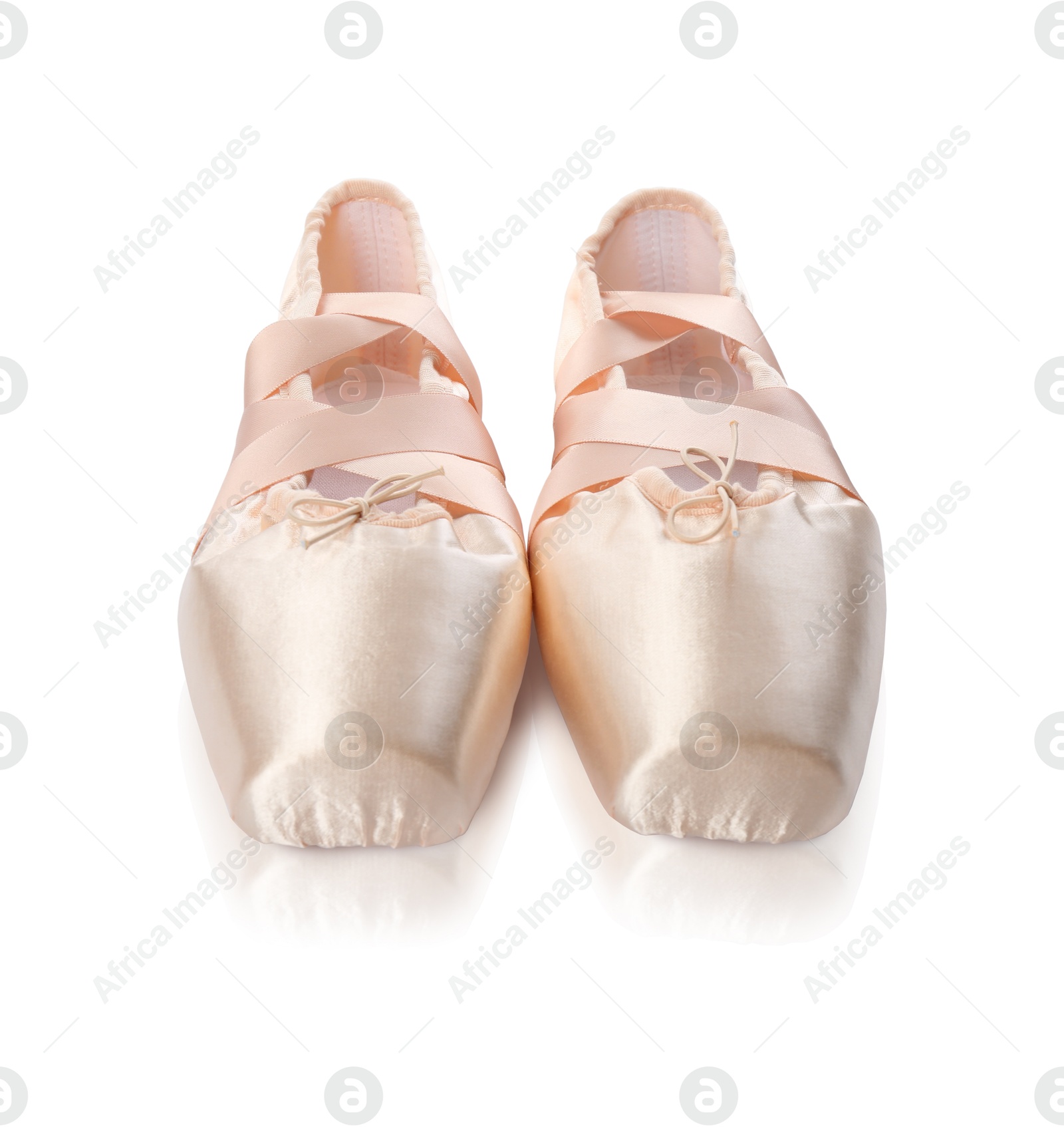 Photo of Pair of beautiful beige pointe shoes isolated on white