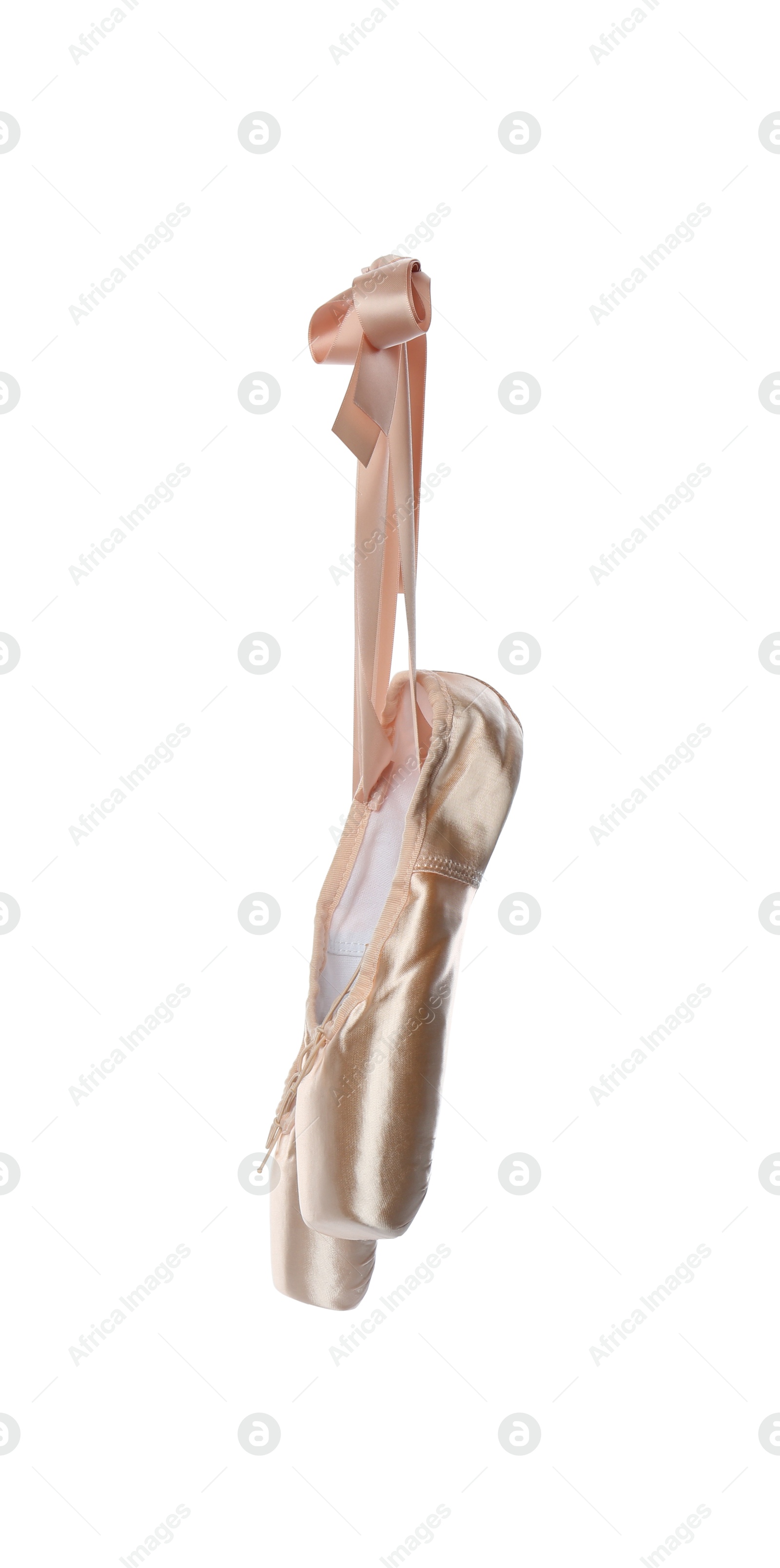 Photo of Pair of beautiful beige pointe shoes isolated on white