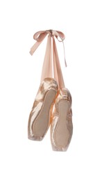 Photo of Pair of beautiful beige pointe shoes isolated on white