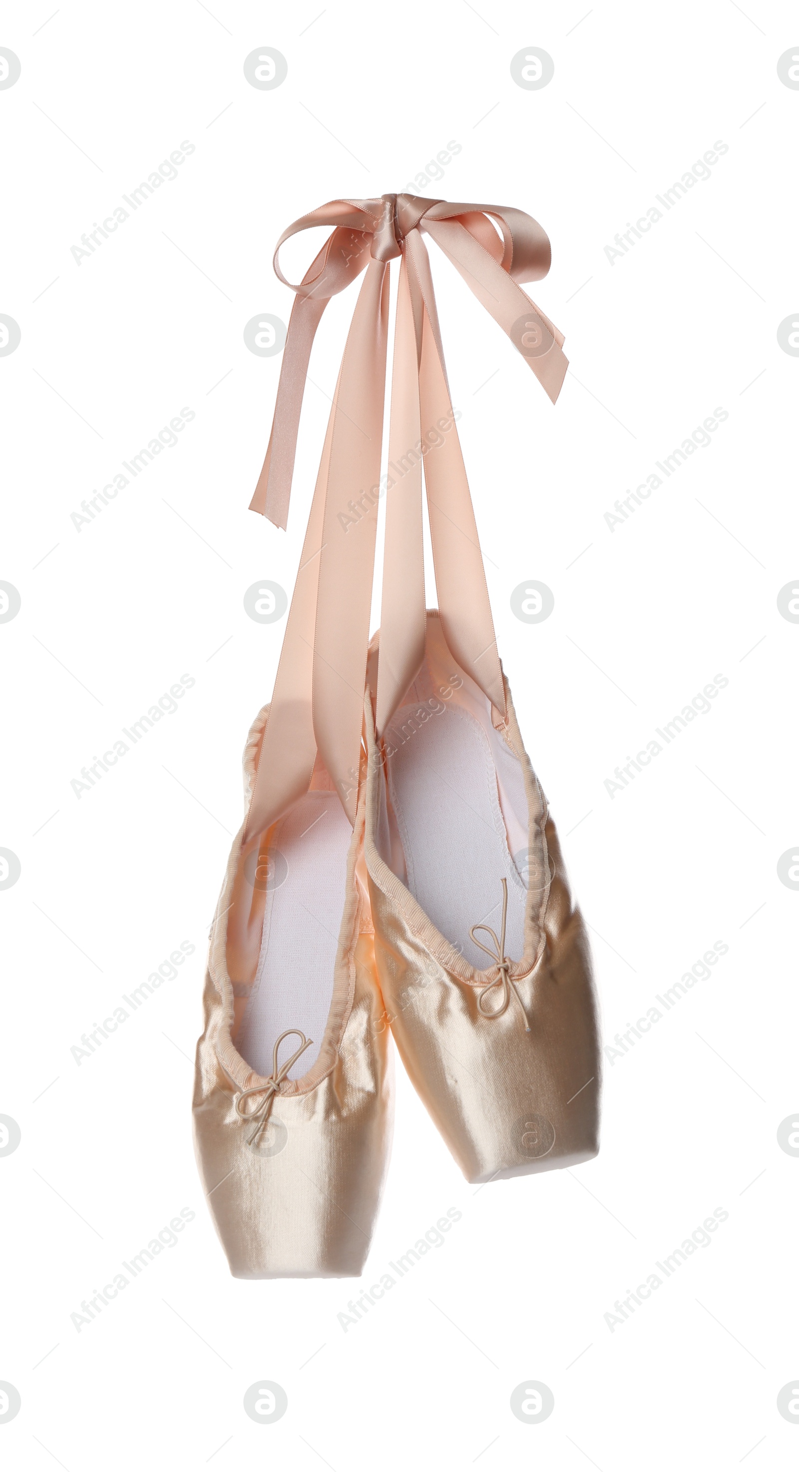 Photo of Pair of beautiful beige pointe shoes isolated on white