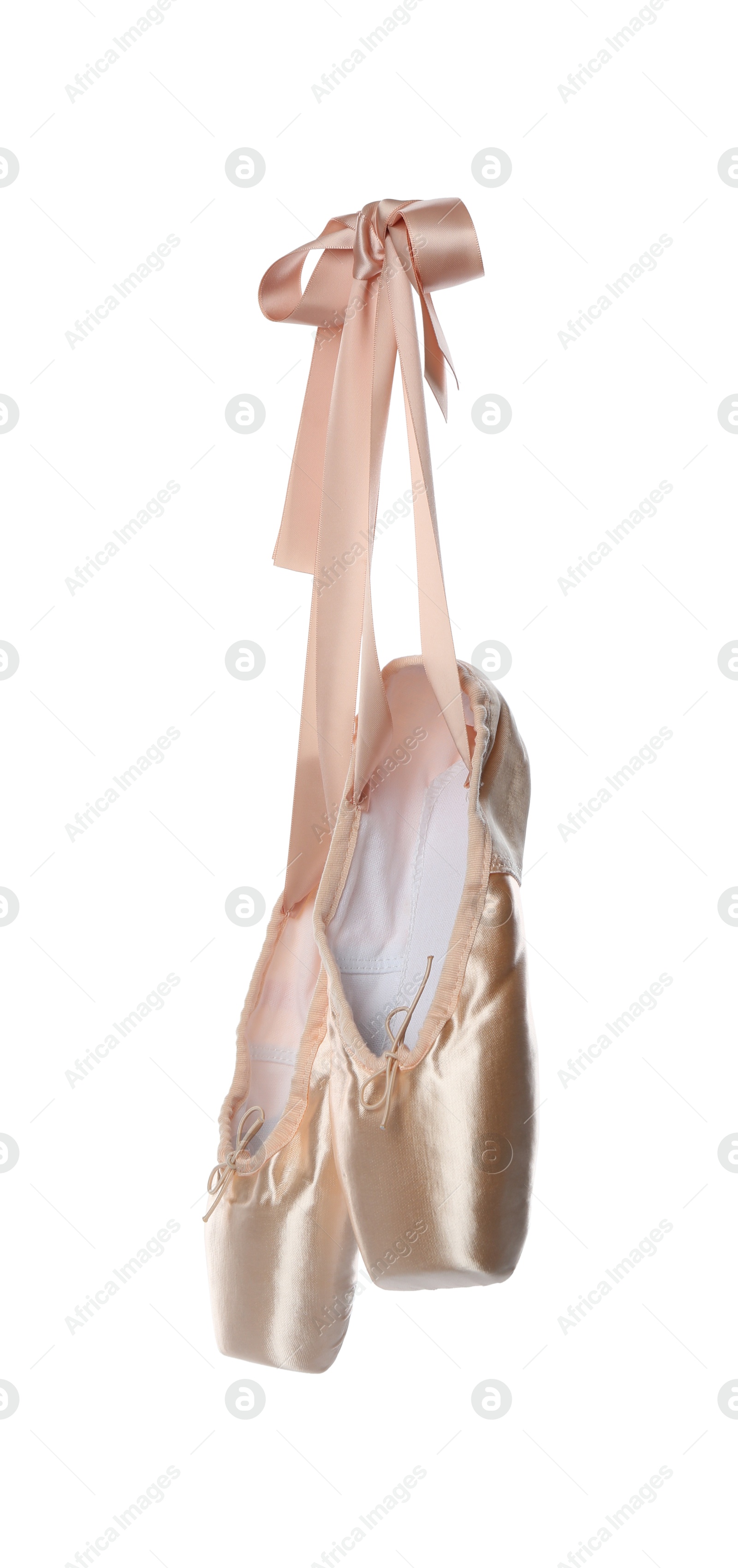 Photo of Pair of beautiful beige pointe shoes isolated on white