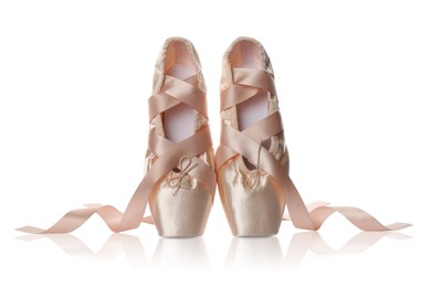 Photo of Pair of beautiful beige pointe shoes isolated on white