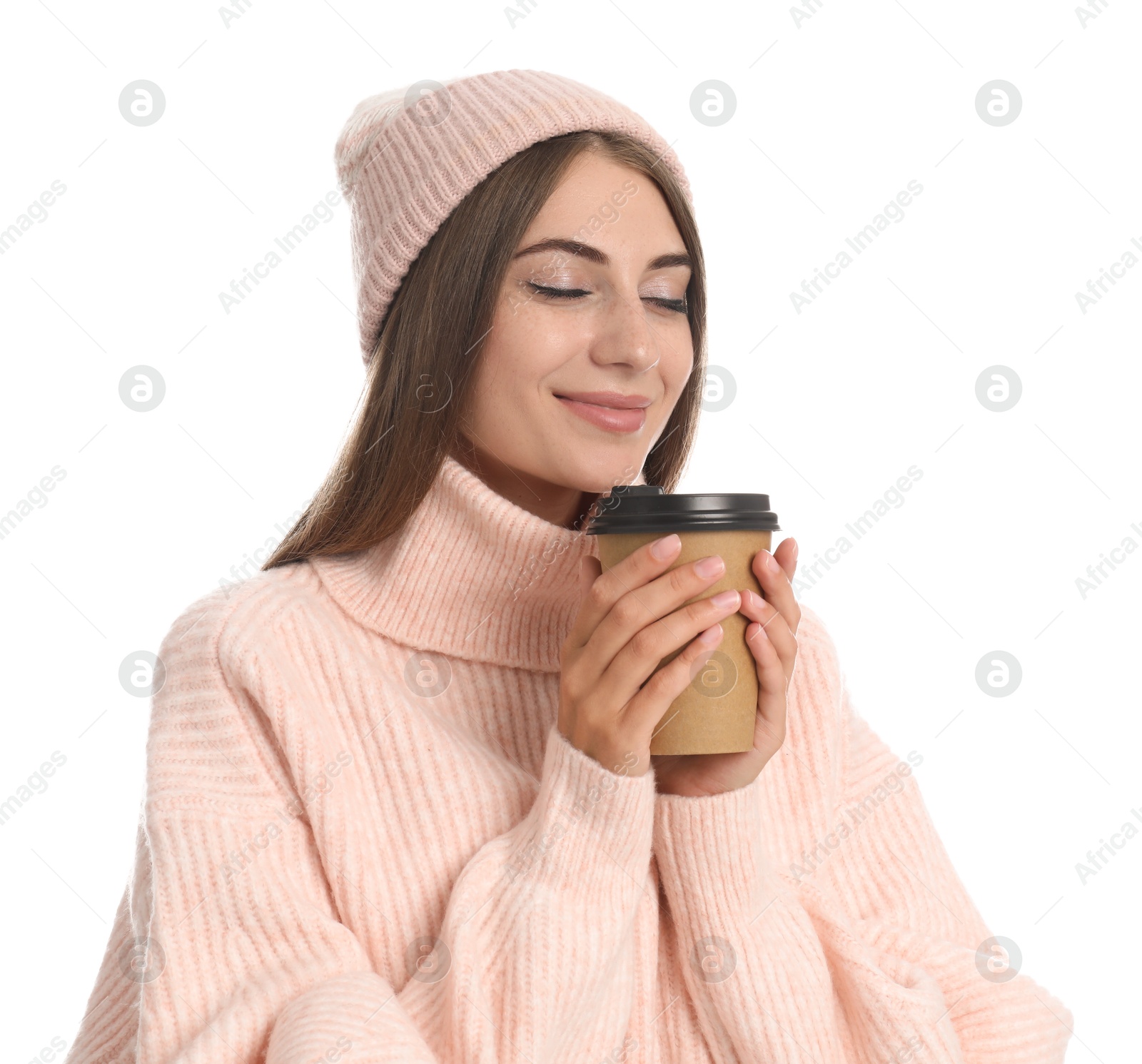 Photo of Happy beautiful woman with paper cup of mulled wine on white background