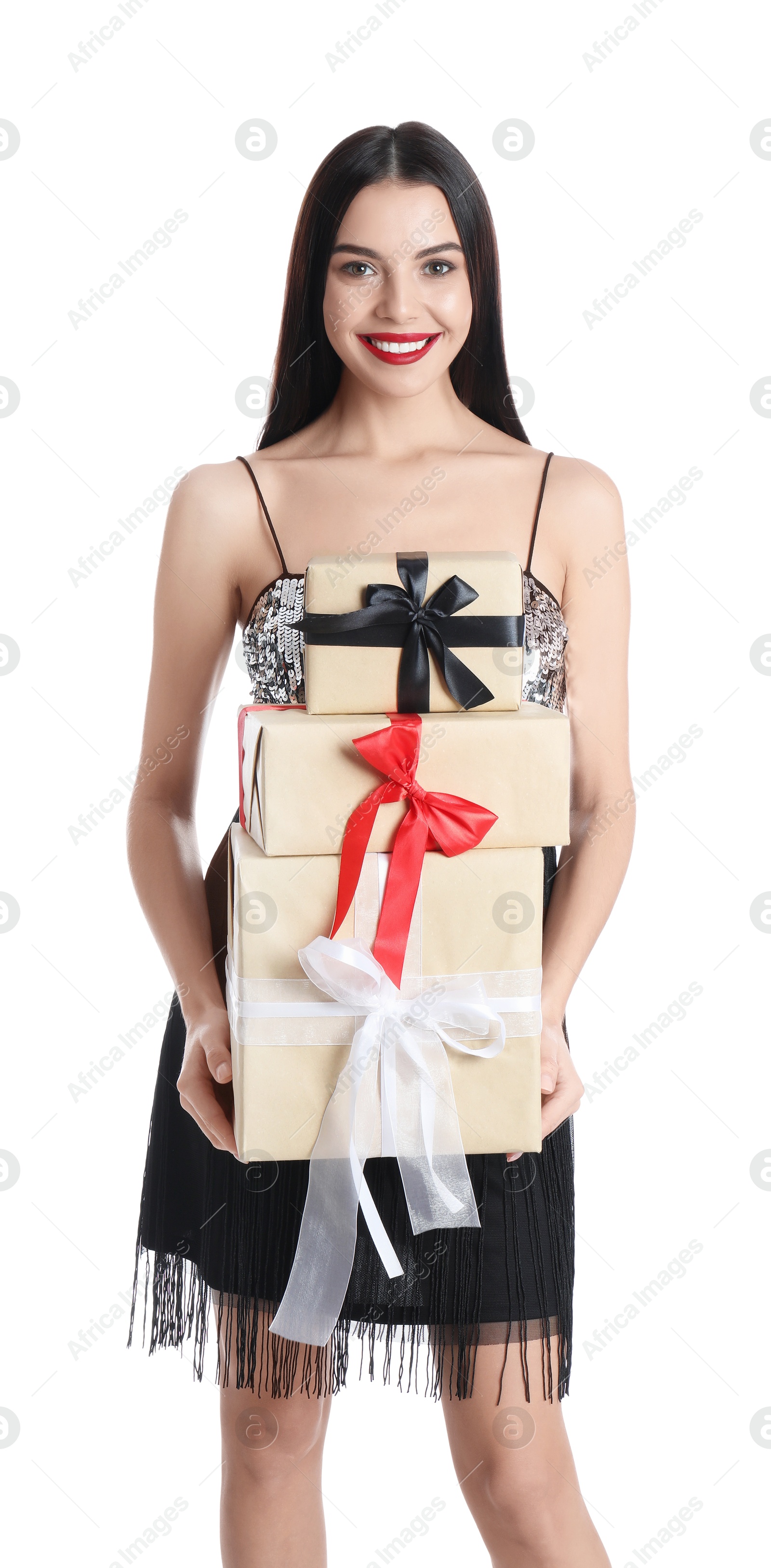 Photo of Woman in party dress holding Christmas gifts on white background