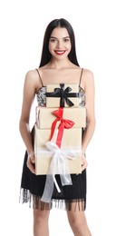 Photo of Woman in party dress holding Christmas gifts on white background