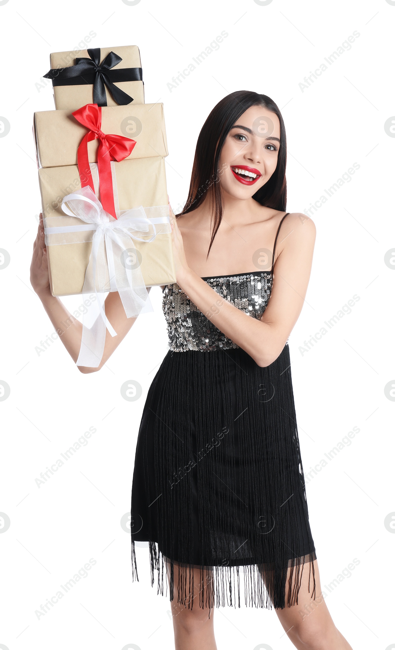 Photo of Woman in party dress holding Christmas gifts on white background