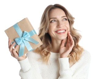 Photo of Beautiful young woman with Christmas present on white background