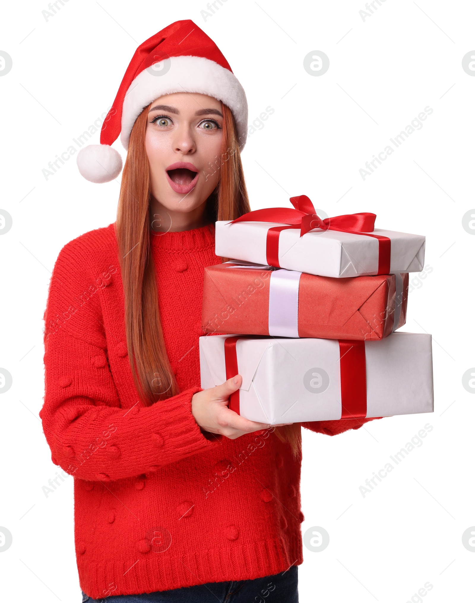 Photo of Emotional young woman in red sweater and Santa hat with Christmas gift on white background