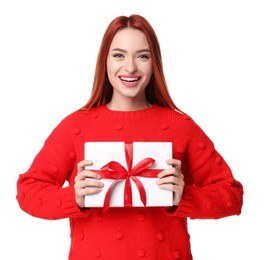 Photo of Young woman in red sweater with gift box on white background. Christmas celebration