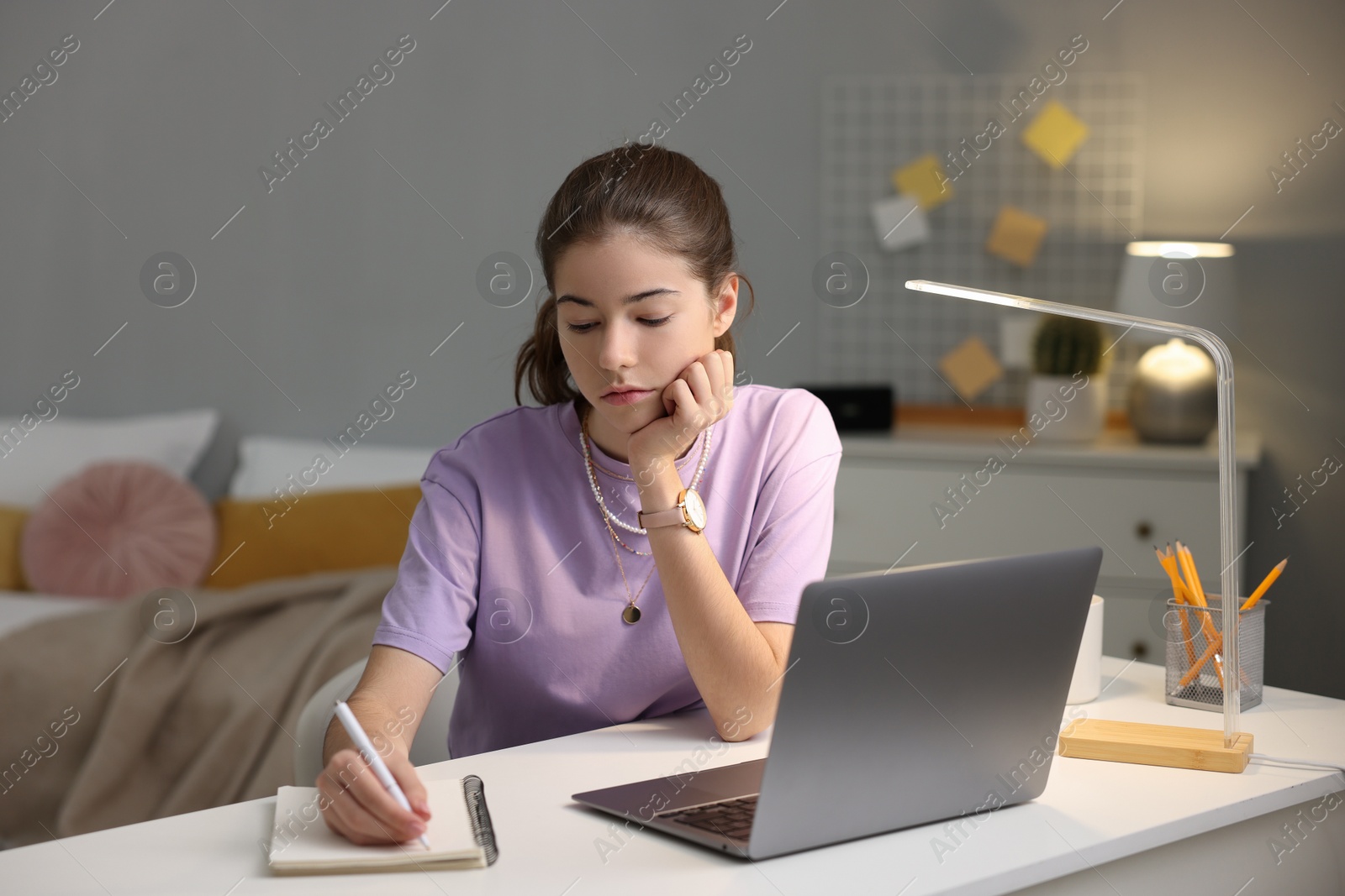 Photo of Student preparing for exam at table indoors