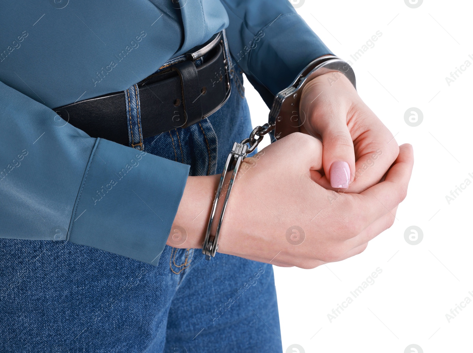 Photo of Woman in metal handcuffs on white background, closeup