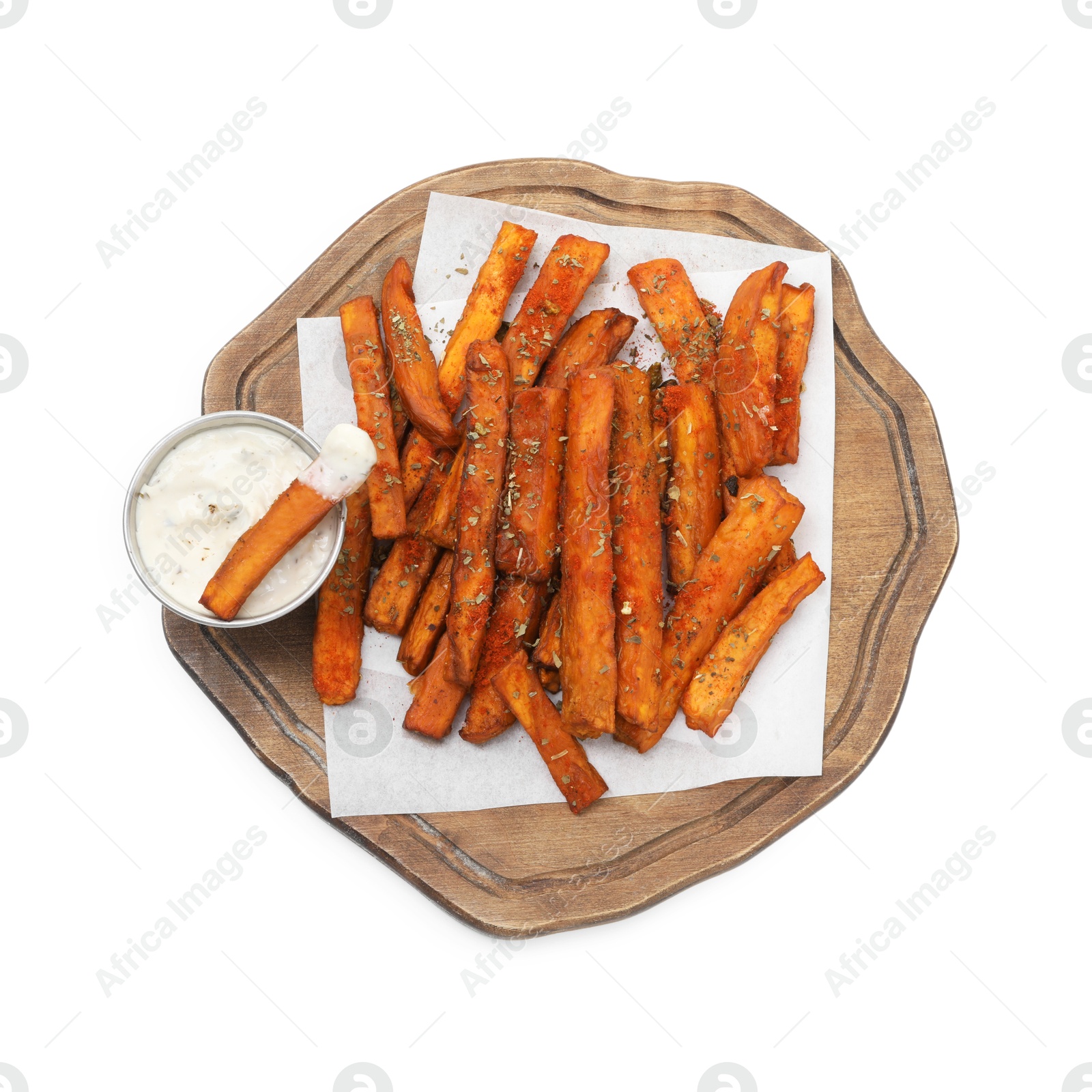 Photo of Delicious sweet potato fries with spices and sauce isolated on white, top view