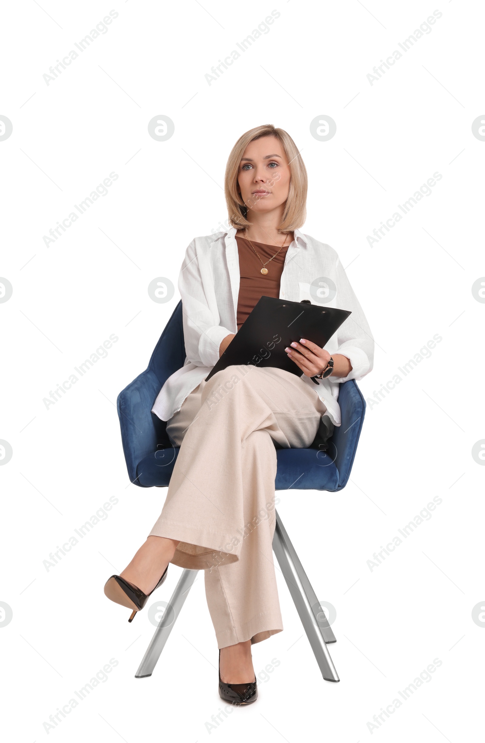 Photo of Professional psychologist with clipboard sitting on chair against white background