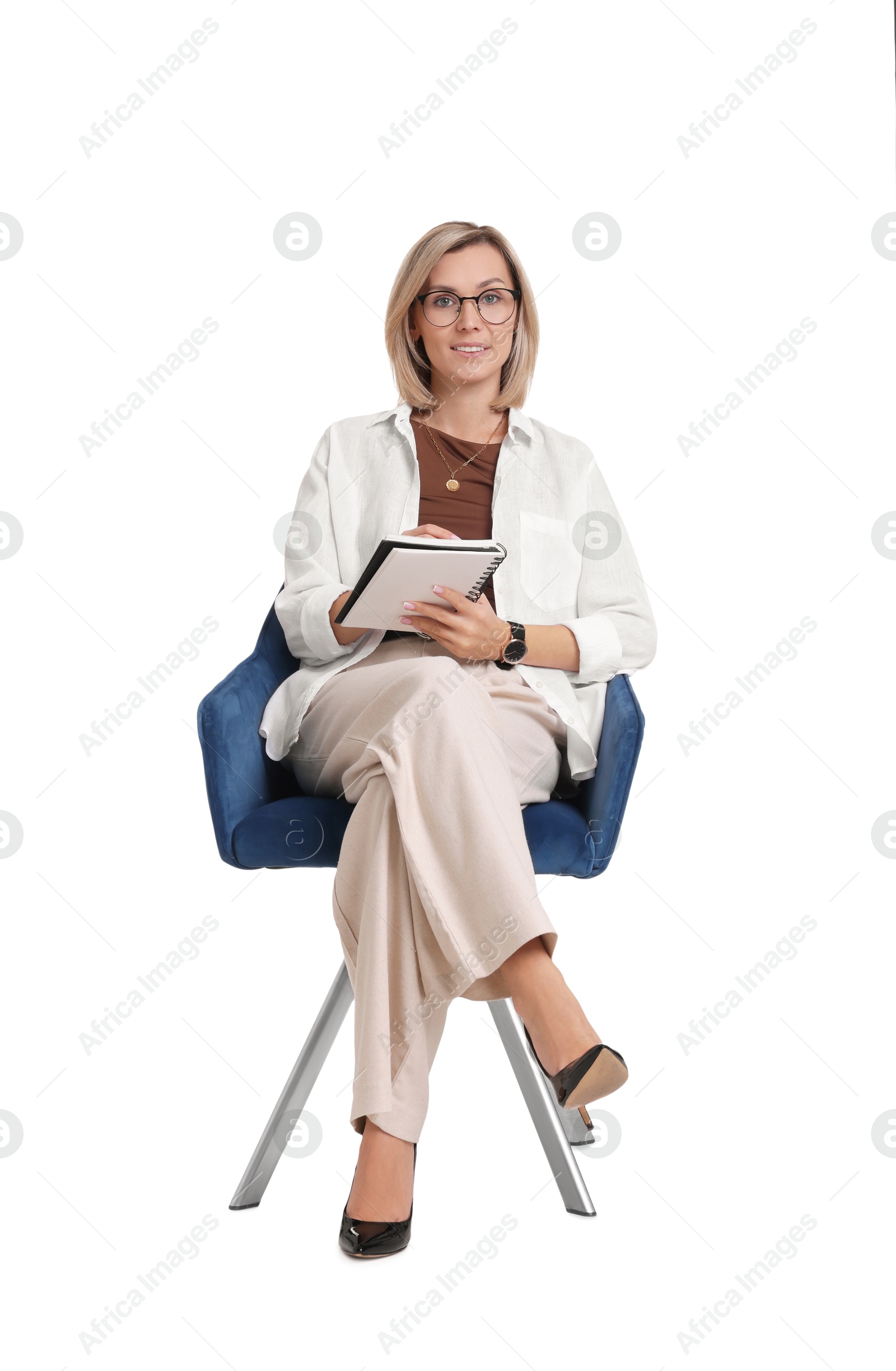 Photo of Professional psychologist with notebook sitting on chair against white background