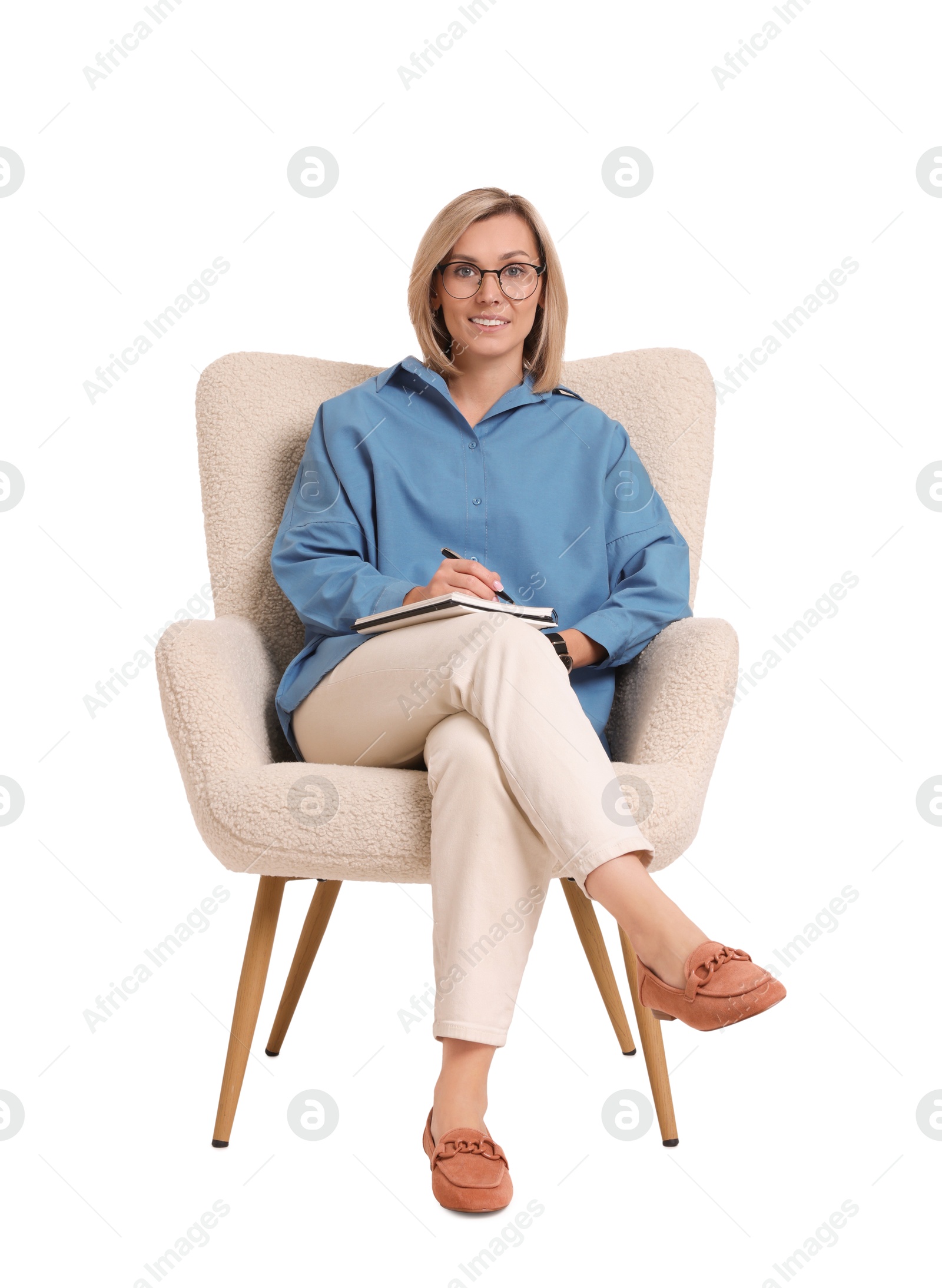 Photo of Professional psychologist with notebook sitting on chair against white background